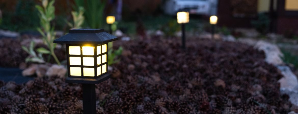 Solar-powered lanterns for flower beds in the yard of the house for decorative street lighting and landscaping