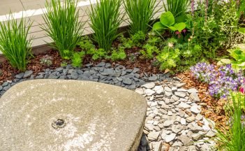 Small water fountain with  cozy seating area for terrace, garden or patio