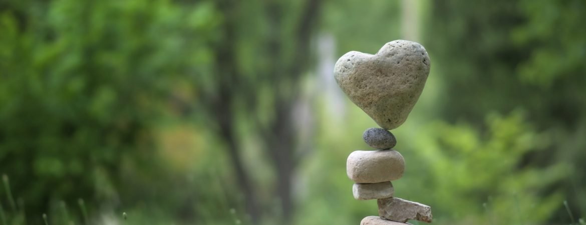 A big balance with a rock on the top